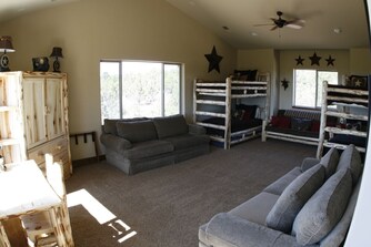 Family bunk room with log-built bunk beds