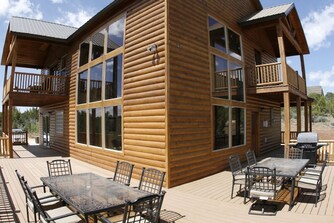 Cabin exterior with large deck and outdoor dining